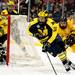 Michigan junior defenseman Mac Bennett handles the puck and skates behind the net in the game against Michigan Tech at Joe Louis Arena on Saturday, Dec. 29. Daniel Brenner I AnnArbor.com